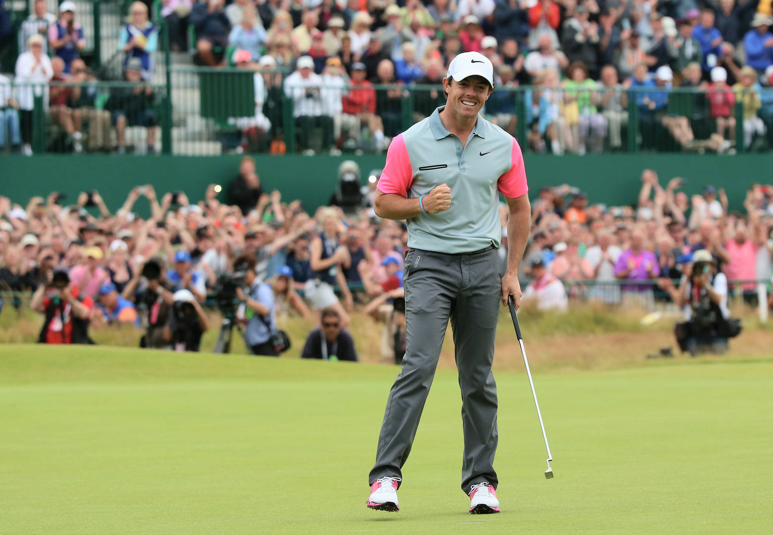 Rory McIlroy pumps his fist on the way to victory at Hoylake in 2014
